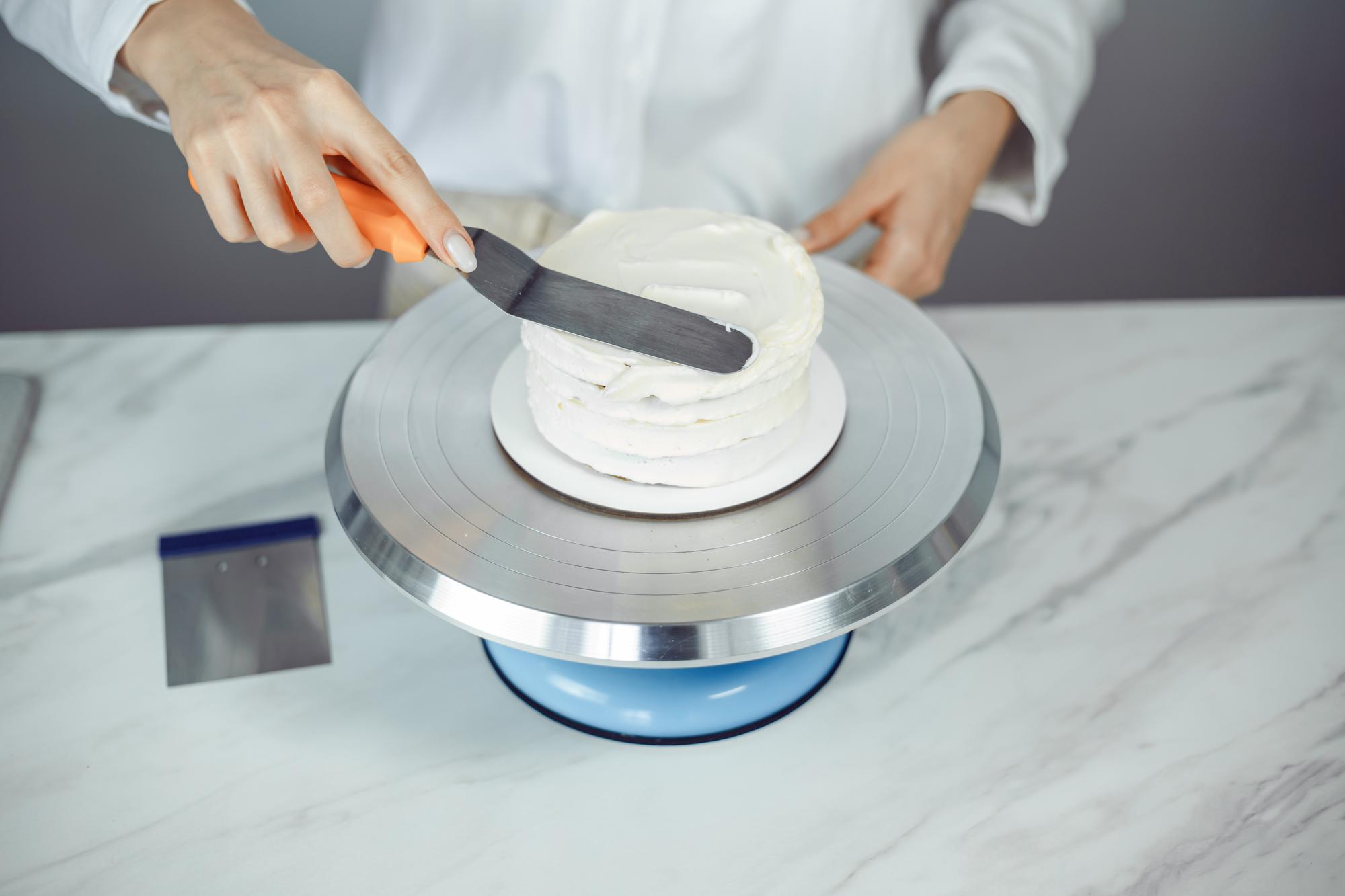 Chef arranging a futuristic plated dish with precision tools